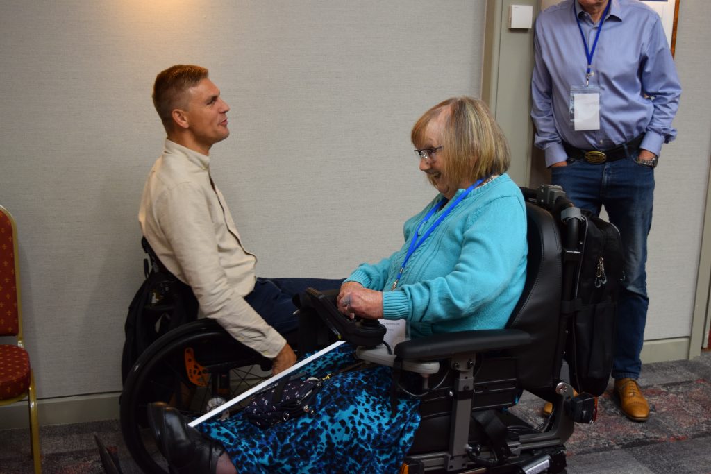 Keynote speaker Steve Brown talking with KCIL patron Ann Macfarlane