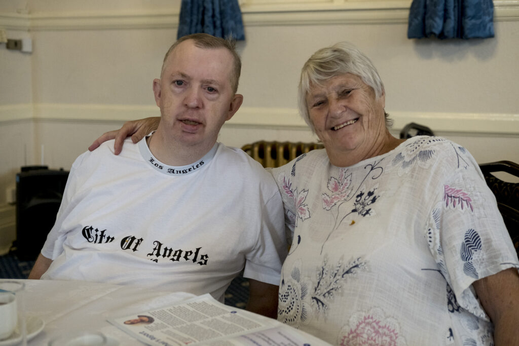 Two KCIL members sitting at a table