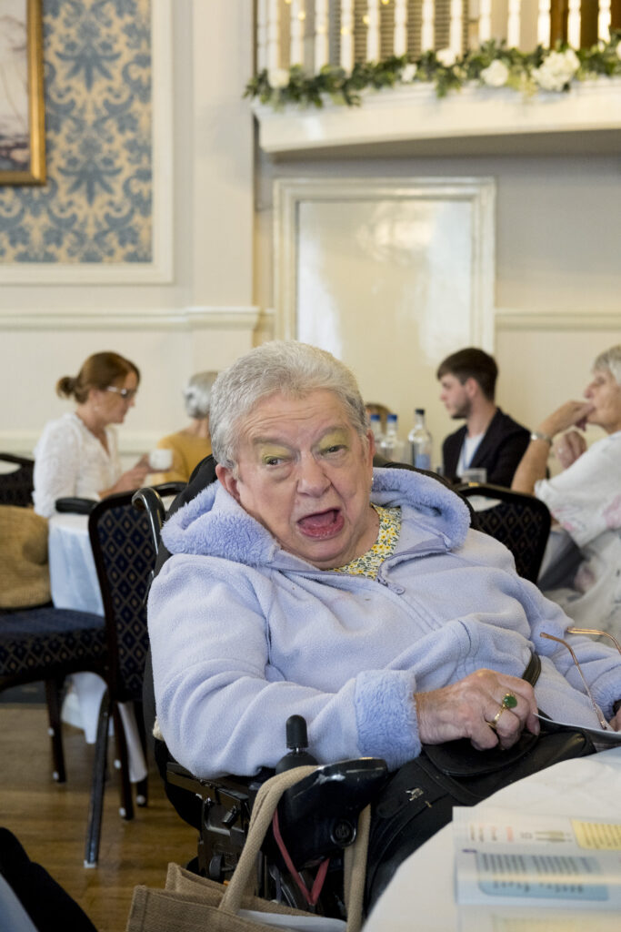 A KCIL member sitting at a table