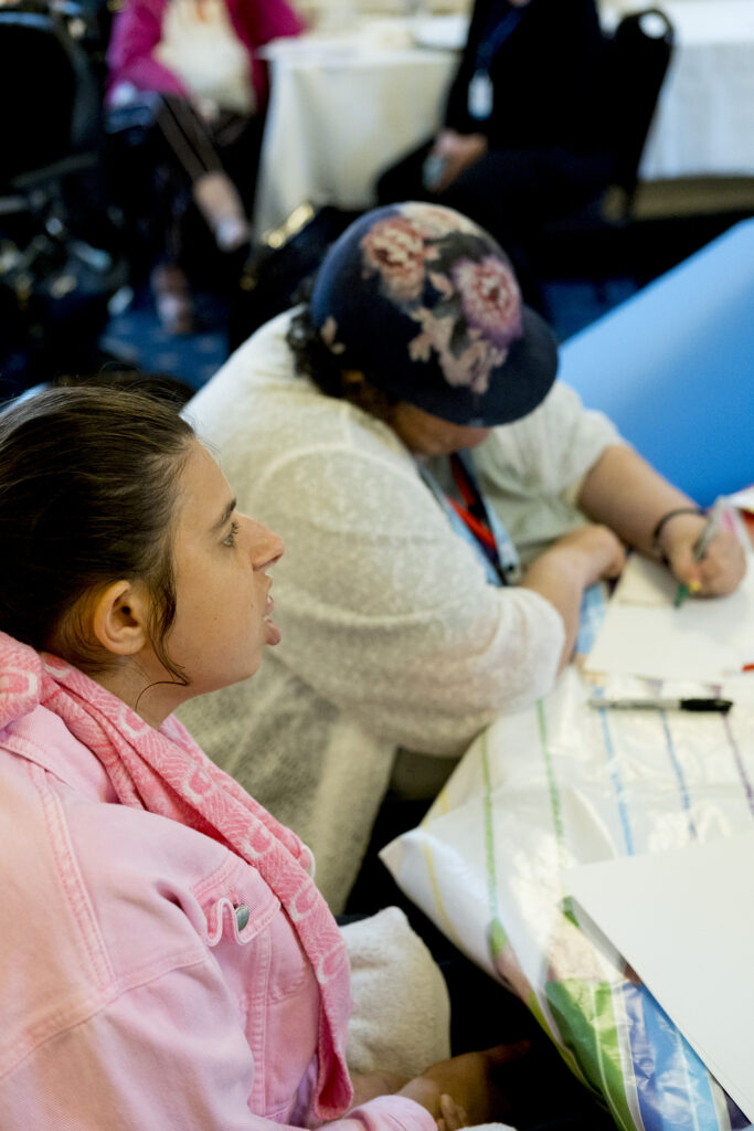 Two people at the art table