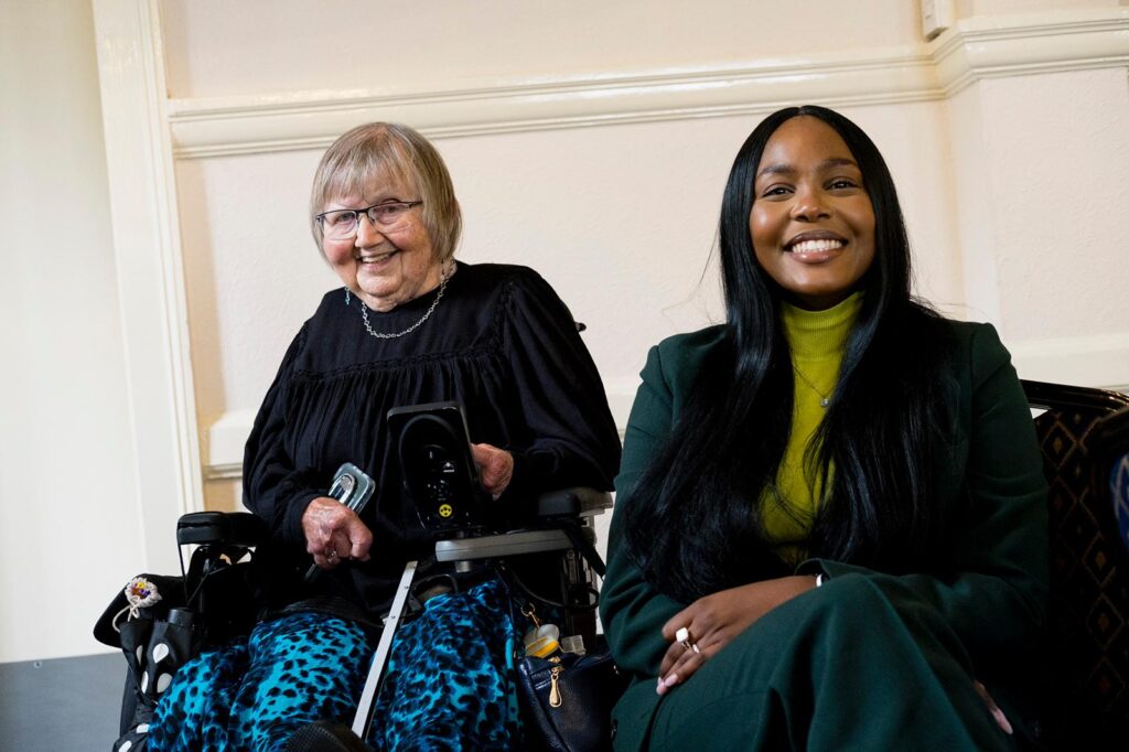 KCIL Patron Ann Macfarlane and keynote speaker Meg Zeenat Wamithi sit together at the conference