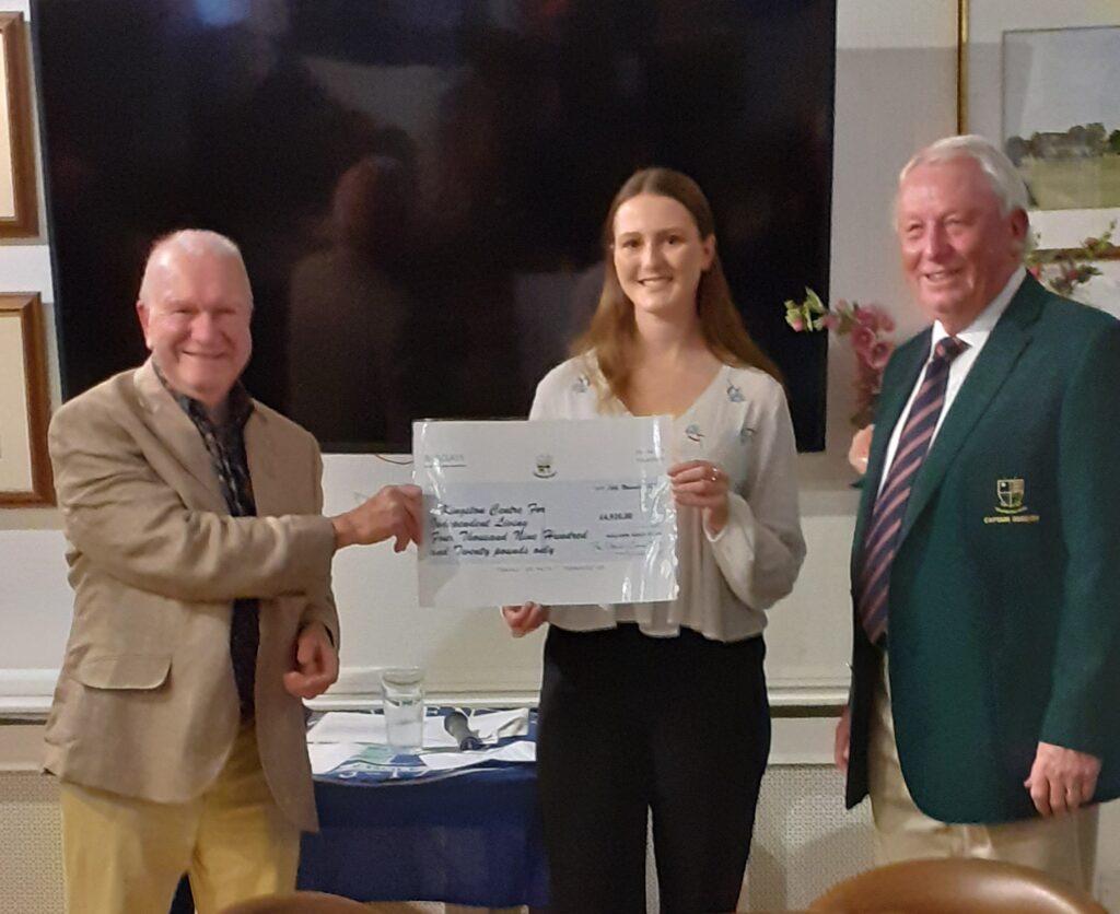 An image of KCIL's Abi receiving a cheque from Malden Golf Club.