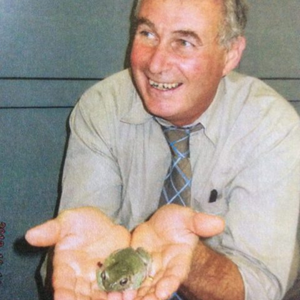 Robert Shaw holding a frog in the palms of his hands