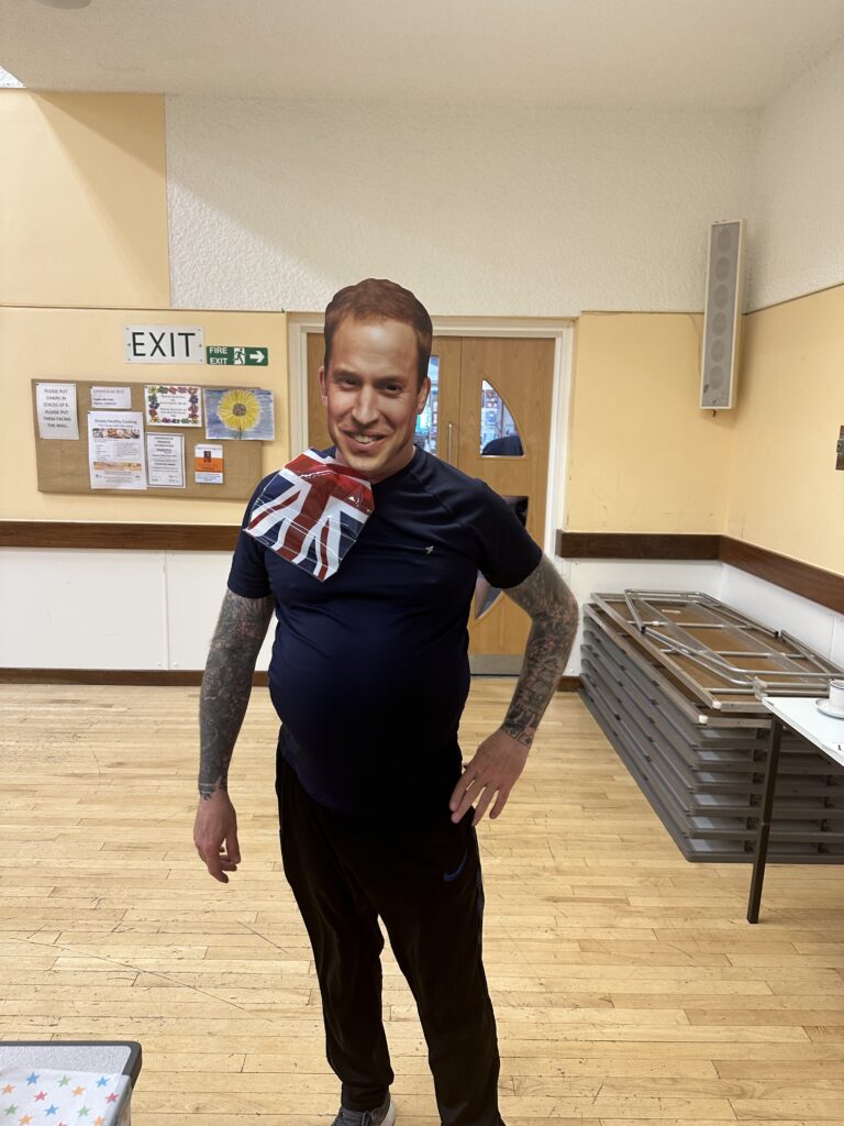 A KCIL member with a Prince William mask