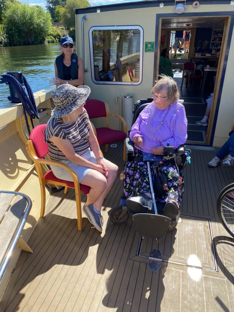 KCIL Trustee Tricia with KCIL Patron Ann outside on the boat