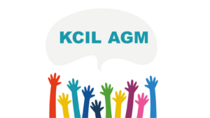 Colourful hands reach up to the sky under a speech bubble that says KCIL AGM