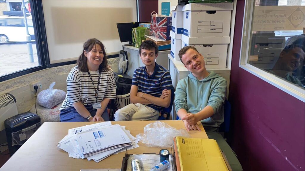 Work experience students in the KCIL office with their teacher