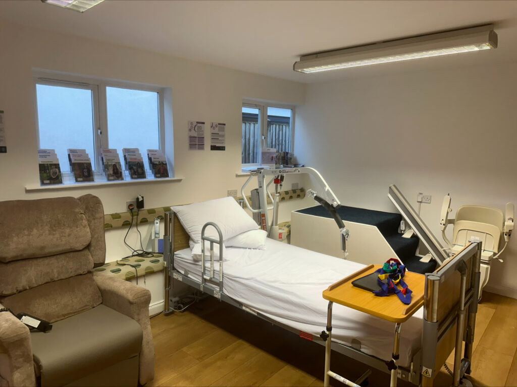 Manual handling training room, with practice arm chair, bed, stairlift