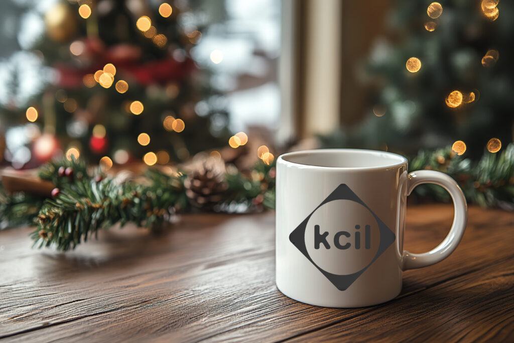 A KCIL mug against a Christmas background