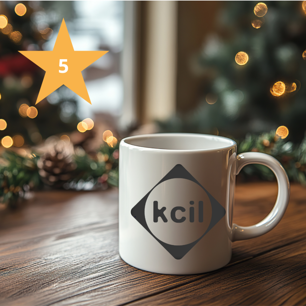 A KCIL mug against a Christmas background