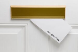 A letter comes through a letter box, with the words 'Kingston Council'