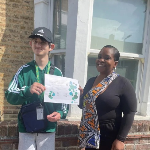 Travel trainer Natalina with a student who has completed training